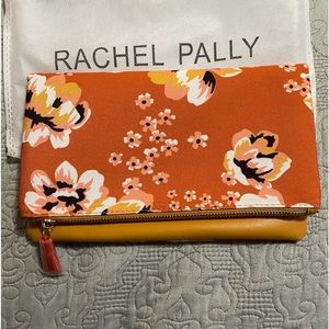 Rachel Pally NWOT clutch in orange, yellow, and white floral print.